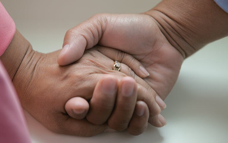 A man and woman holding hands